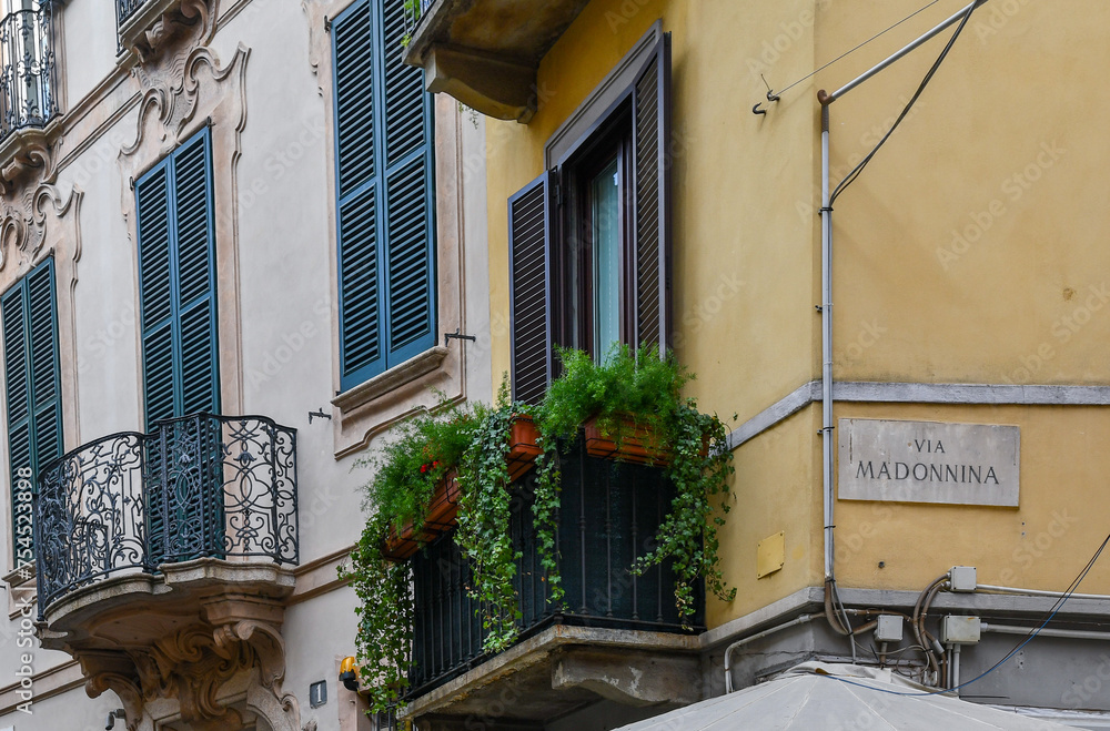 Wall mural corner of an old house with the street sign of via madonnina in the historic district of brera, mila