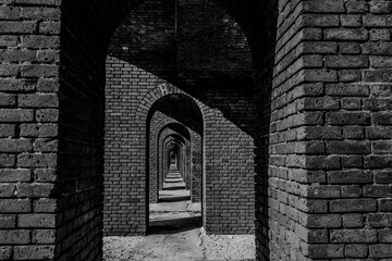 Endless brick passage with repeating archways in Fort Jefferson on Dry Tortugas National Park.