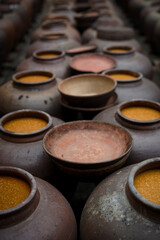 Close up photo of traditional soy sauce in ceramic pot in craft village near Hanoi in Vietnam