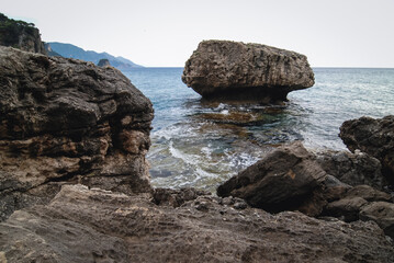 Fototapeta na wymiar Rocky Ionian Sea shore near Sinarades village on Corfu Island, Greece