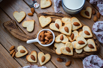 Sweet dessert for breakfast: cookies with almonds. Close-up