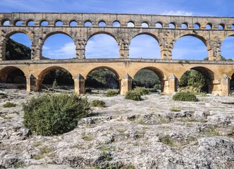 Photo sur Plexiglas Pont du Gard Ancient Roman bridge Pont du Gard over Gard river near Vers-Pont-du-Gard town, France