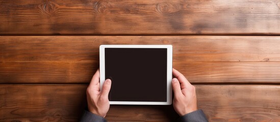 Modern Technology: Person Engaged with a Tablet with a Blank Screen in a Contemporary Setting