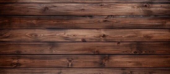 Fototapeta na wymiar A close-up view of a wooden wall with a dark coffee brown stain covering its surface. The natural wooden planks display a textured background, adding depth to the overall appearance.