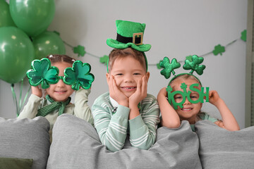 Cute kids celebrating St. Patrick's Day at home party