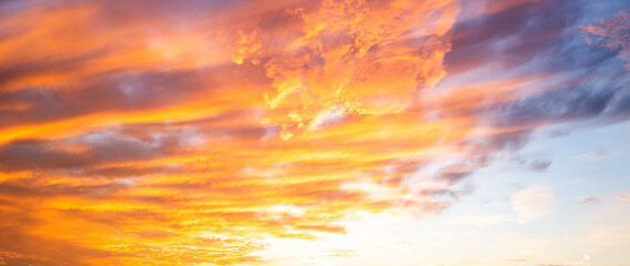 Dramatic Colorful Sunset Sky. Clouds with Sunrays. Cloudscape Sunset Background. Panorama Sky....