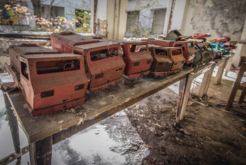 Toy cars in Kindergarten No. 10 Cheburashka in Pripyat ghost city in Chernobyl Exclusion Zone, Ukraine