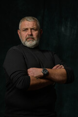 studio portrait of a brutal man with a gray beard 1