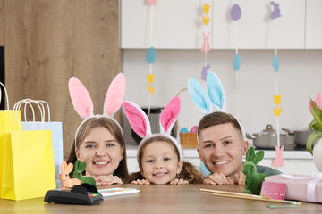 Happy family with shopping bags at table in kitchen. Easter Sale