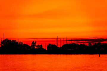 Fototapeta na wymiar Red Sky in the Morning at Cherry Beach