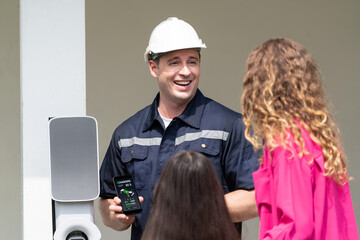 Technician install home EV charging station, providing service support for EV app on customer...