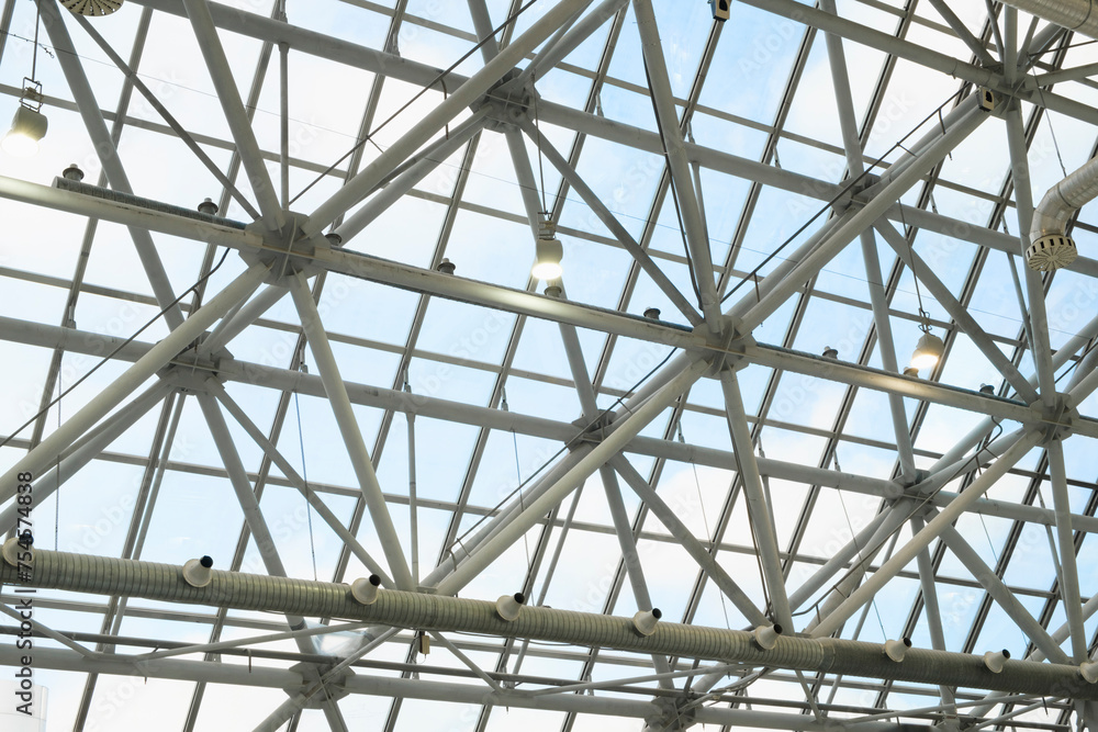 Poster clear glass roof can see through the sky. large round steel structure beautiful geometric shapes and