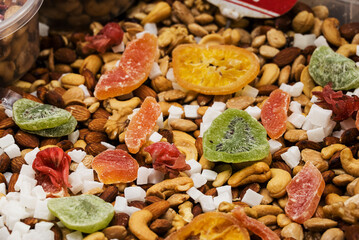 A picture of a composition of various dried fruit on a market