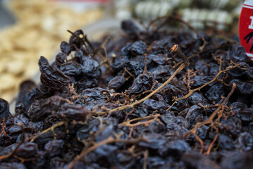 A picture of a composition of various dried fruit on a market