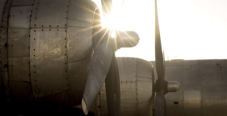 Military plane and propellers with sunburst 