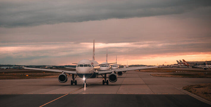 London, England: airplanes at the Heathrow airport runway