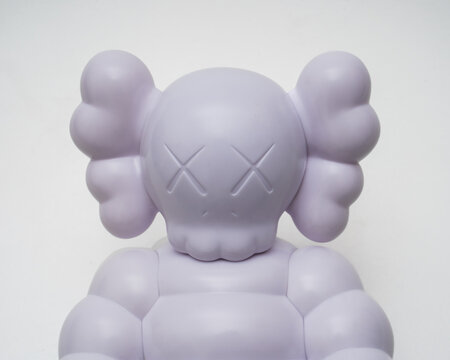 detail of Kaws What Party - Chum figure. by artist Brian Donnelly. isolated white background. Milan Italy. August 29 2023