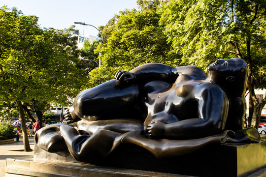 MEDELLIN, COLOMBIA - JANUARY 17, 2024: Reclining Woman. Bronze sculptures by the famous Colombian artist Fernando Botero Angulo in the square that bears his name in the center of the city of Medellin.