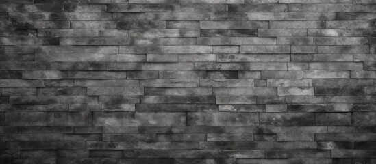 A black and white photo showcasing the abstract weathered gray grunge brick wall texture, perfect for dark interior room decoration and urban building material backdrop design.