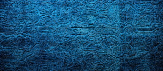 Obraz premium The close-up shot showcases a detailed view of a blue quilted material, perfect for interior design, wallpaper, background, or cover page purposes.