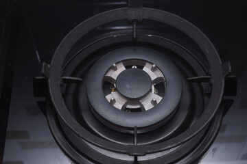 A black gas stove with a glass coating