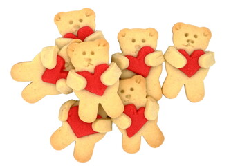 Several cake bears with a big red heart. Concept of sleeping teddybear cookies. White background.