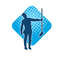Silhouette of a worker carrying shovel tool. Silhouette of a worker in action pose using shovel tool.
