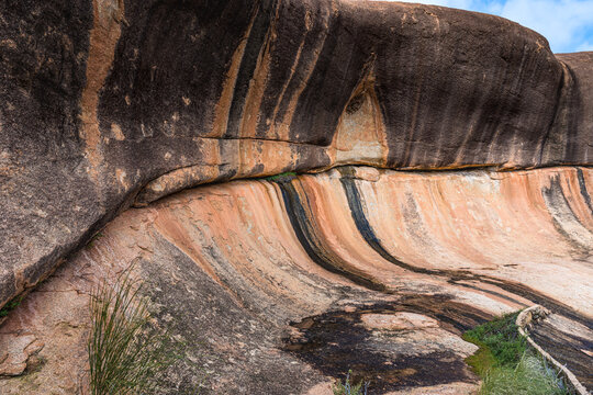 Curved wall of huge gnamma hole at Beringbooding Rock.  A granite rock formation north east of Mukinbudin in the eastern Wheatbelt region of Western Australia.