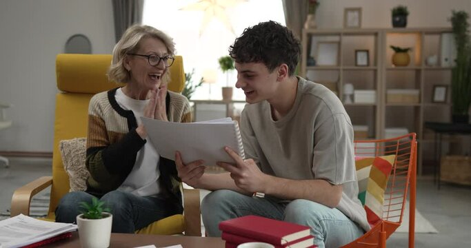 student caucasian man study with help of his tutor professor or mother