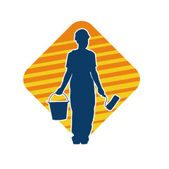 Obraz premium Silhouette of a female worker carrying painting tool. Silhouette of a woman painter worker in pose.