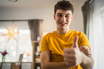 Portrait of young caucasian teen male young man stand at home