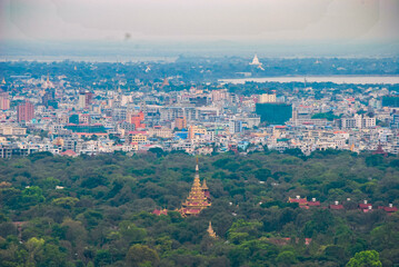 The landscape of Mandalay, Myanmar overlook the Royal palace that surrounded by the forest and local residential area