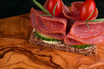 Salami smoked sausage slices on background