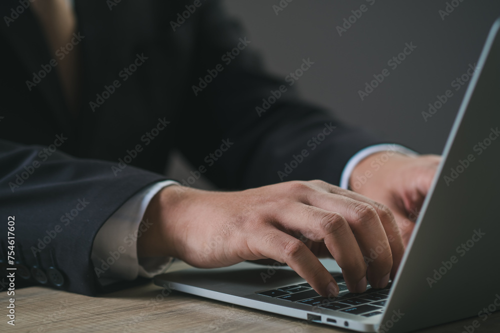 Wall mural businessman's hands are finger point to searching for information. using laptop with your website. d