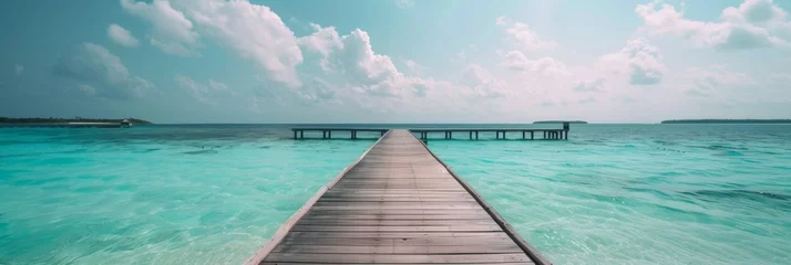 Foto op Canvas Beach pier with turquoise ocean © InfiniteStudio