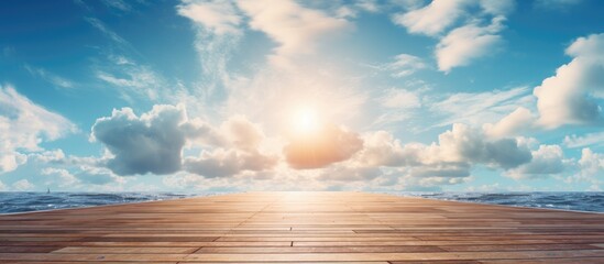 A wooden pier extends from the shore, reaching into the calm waters below. The sun shines brightly...
