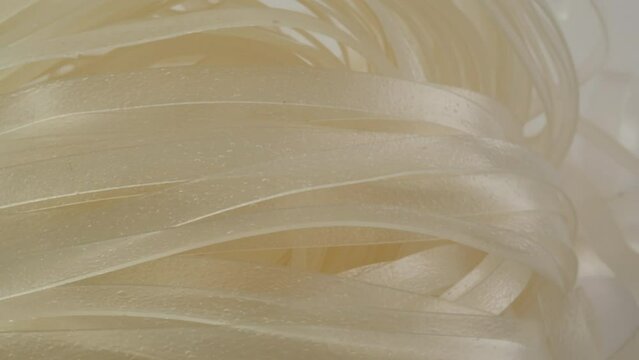 Close-up of instant noodles texture. Asian fast food with meat and spices. Instant noodles, or instant ramen, is a type of food consisting of noodles sold in a precooked and dried block with