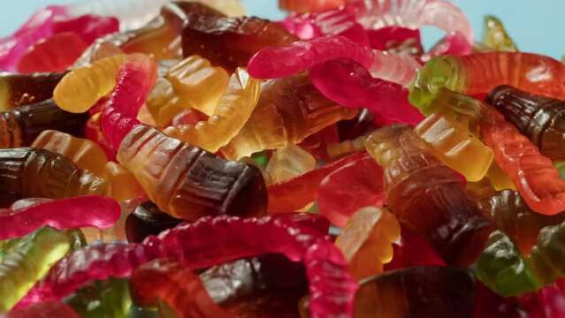 Jelly marmalade cola bottle bear close up, Confiture Bean candy jujube Marmalade bears with cod cannabis close up. 