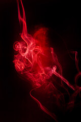 Red smoke motion on black background. - 754642637