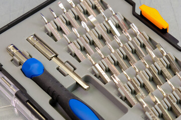 Universal tool box, tool kit closeup with set of hex, torx and screwdriver bits, and various sizes...