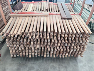 Round tapered furniture leg stacking in factory.