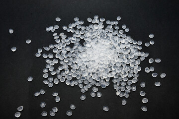 Virgin polypropylene (PP) granules on a black background, this polymer is one of the main materials...