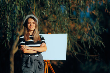 Happy Artist Standing in front of a Blank Canvas in Nature. Painter sitting in plain air waiting...