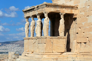 The Temple of Erechtheion's famous porch with 6 caryatids in the Acropolis. - obrazy, fototapety, plakaty