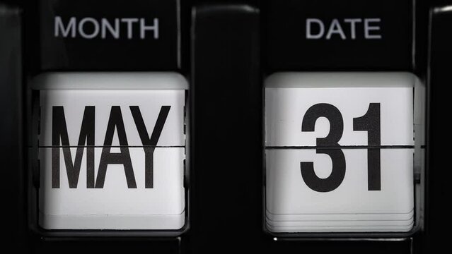 retro flip calendar with a date change from the thirtieth of May to the thirty-first of May. daily calendar with a change of days of the month. close up.