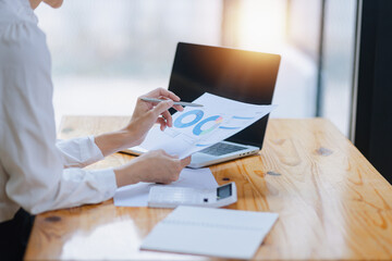 Business financial analytics data advisory concept. Businesswoman working on digital laptop...