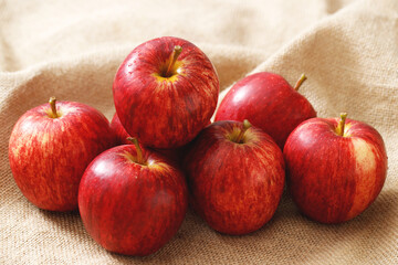 fresh red apples on the wooden floor