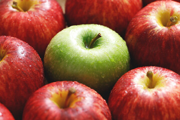 fresh red and green apples on the wooden floor