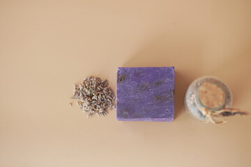 Homemade natural soap bar and lavender flower on table 