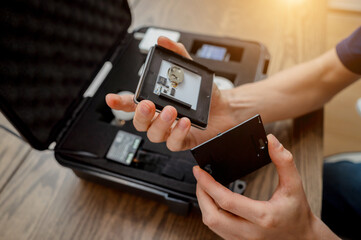 A technician works with a demo kit of the smart home system